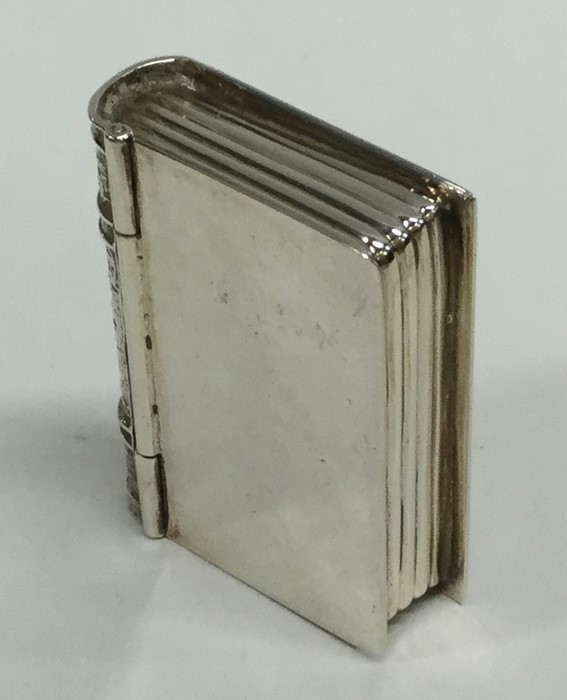 A silver pill box in the form of a book with engra - Image 2 of 3