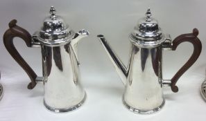 A pair of Edwardian silver café au lait pots with