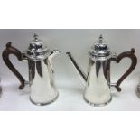 A pair of Edwardian silver café au lait pots with