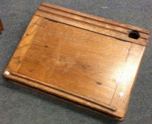 A wooden sloping desk top with hinged lid. Est. £1