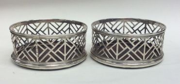 A good pair of Georgian silver wine coasters with