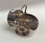 An unusual silver model of a coal scuttle with swi