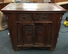 A Continental two door sideboard with tapering sid