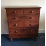 A mahogany chest of five drawers on turned support
