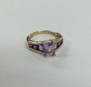 A 9 carat amethyst seven stone ring. Approx. 3 gra