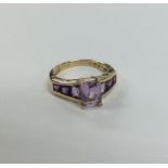 A 9 carat amethyst seven stone ring. Approx. 3 gra