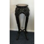A Chinese hardwood pedestal plant stand with marbl