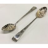 A pair of large silver engraved basting spoons wit