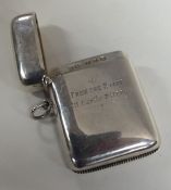 A large heavy silver vesta case with hinged top. B