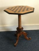 A Victorian games table on three spreading support