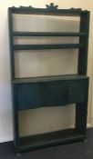 A small painted pine bookcase with single drawer.