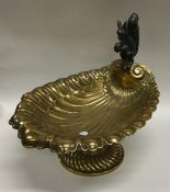 An attractive brass pedestal dish mounted with a s