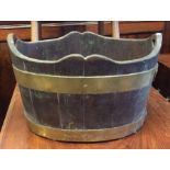 An oak and brass mounted peat bucket with shaped r