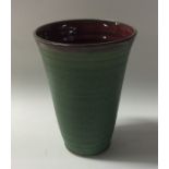 FRANCO BALDUCCI (Italian): A green San Gimignano pottery cup / vase