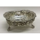 A good quality chased silver sugar bowl with crimp