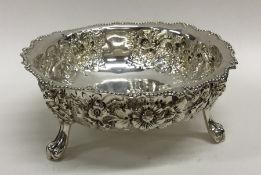 A good quality chased silver sugar bowl with crimp