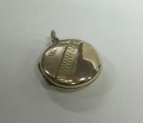A 9 carat circular back and front locket with engi
