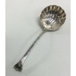 A Georgian silver sauce ladle with fluted bowl and