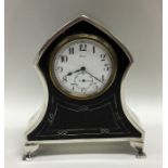 An unusual tortoiseshell and silver clock with whi