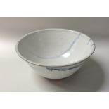 A stylish decorative pottery bowl with white glaze