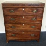 A Victorian chest of four drawers with brass handl