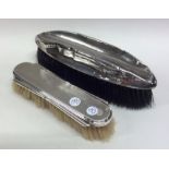 Two silver engine turned hairbrushes. Est. £20 - £