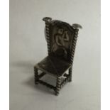 A small Continental silver model of a chair mounte