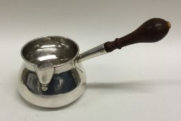 EXETER: An early Georgian silver brandy pan with t
