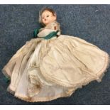 A Victorian wax headed doll decorated in ball gown