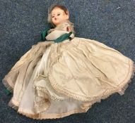 A Victorian wax headed doll decorated in ball gown