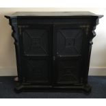 A large shaped front two door ebonised side cabine