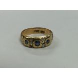 An 18 carat gold sapphire and diamond ring. Approx