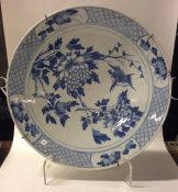 A large blue and white Chinese wall charger decora