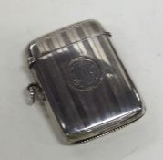 A massive engine turned silver vesta case with hin