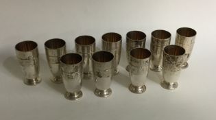 A set of twelve Continental silver vodka tots. App