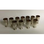 A set of twelve Continental silver vodka tots. App