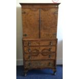 An Edwardian mahogany cocktail cabinet with four d