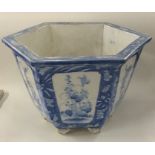 A Chinese blue and white hexagonal planter on pede