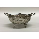 An attractive two handled chased silver bonbon dis