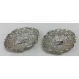 A pair of silver pierced sweet dishes attractively