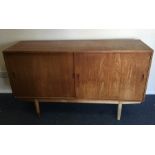 A retro Danish sliding door sideboard. Est. £30 -