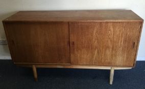 A retro Danish sliding door sideboard. Est. £30 -