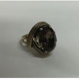 A large 9 carat smoky quartz single stone ring. Ap