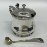 A large heavy silver baluster shaped mustard pot w