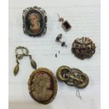 A bag containing cameo brooches etc. Approx. 37 gr