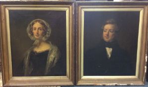 A pair of gilt framed oil portraits on canvases de