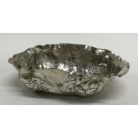 A Continental 17th Century chased silver dish deco