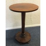 A Victorian mahogany pedestal table on circular ba