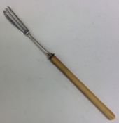 A Victorian silver pickle fork with bone handle an