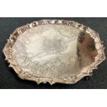 A large George II silver salver with crested centr
